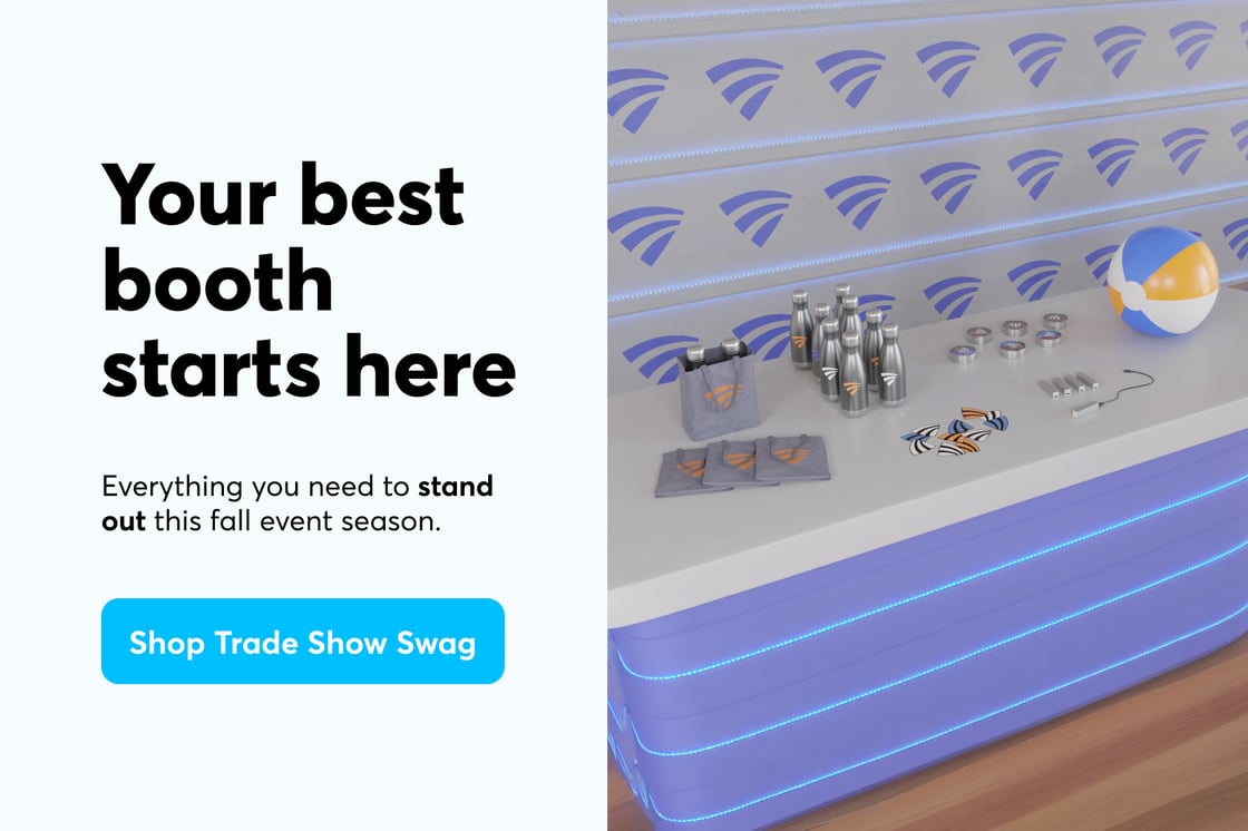 A purple event booth with a variety of customized swag items. Header text reads "Your best booth starts here," with a button below it that says "Shop Trade Show Swag."